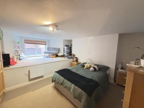 A spacious and well-maintained master bedroom f...