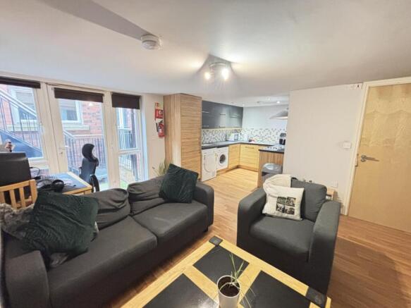 A spacious and welcoming living room featuring ...