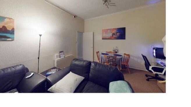 A contemporary living room with a comfortable b...