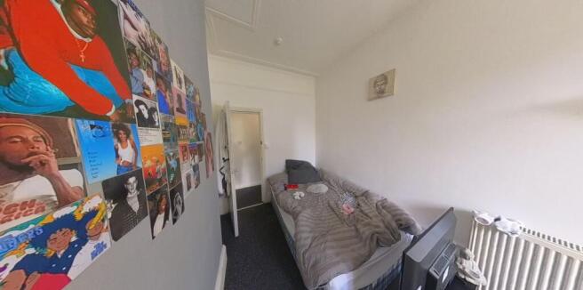 A spacious and well-maintained master bedroom f...