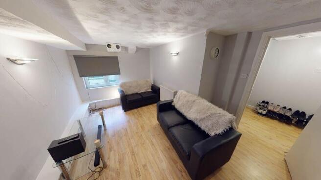 A spacious and inviting living room with ample ...