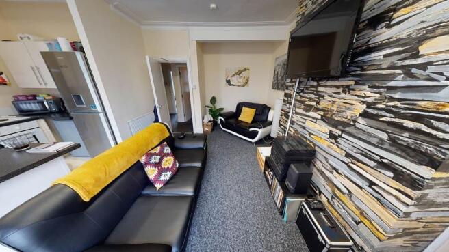 A modern and well-lit living room featuring a c...