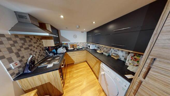 A modern, well-lit kitchen with contemporary ca...