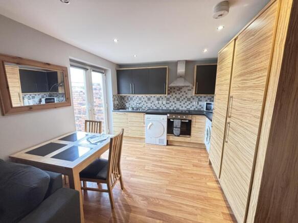 A bright and modern living room featuring ample...