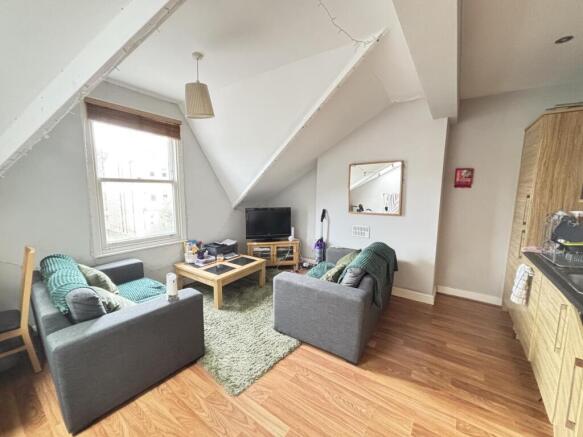 Bright and welcoming living room with modern fu...