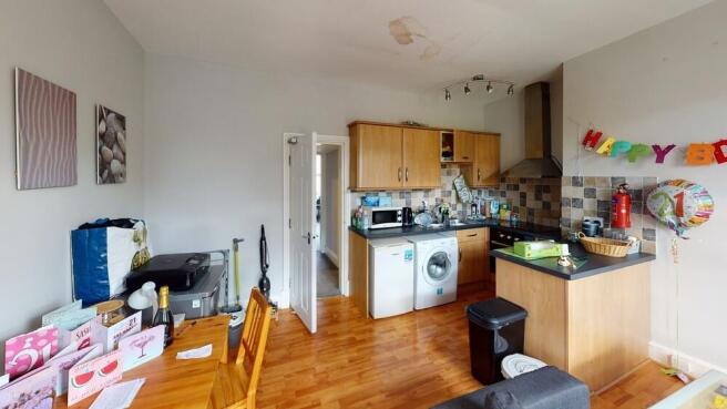 A spacious and well-lit living room featuring m...