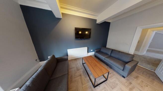 A spacious and modern living room featuring con...