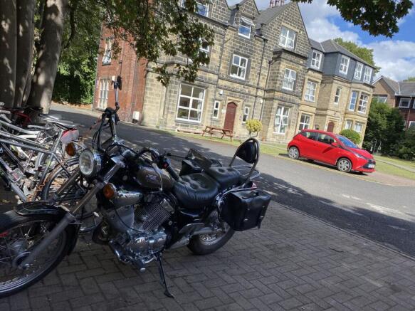 Exterior view of a historic stone-built residen...