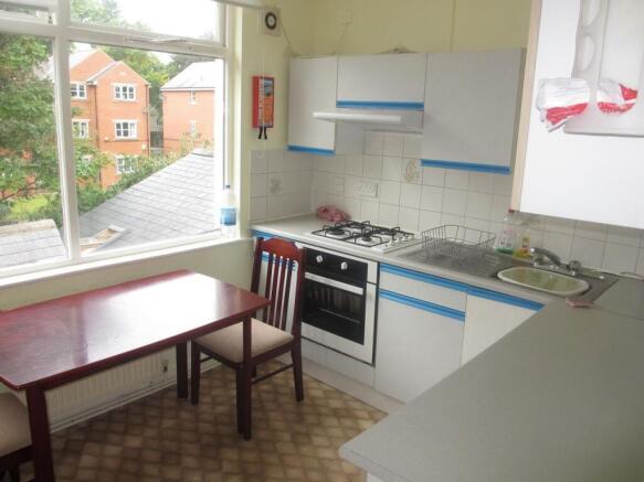 Bright and functional kitchen with ample natura...