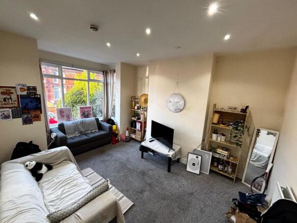 Bright, relaxed living room with a large front ...