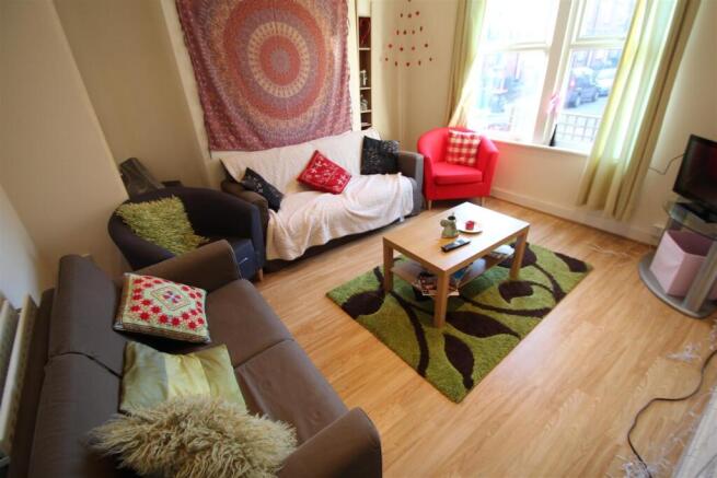 Bright and welcoming living room with large win...
