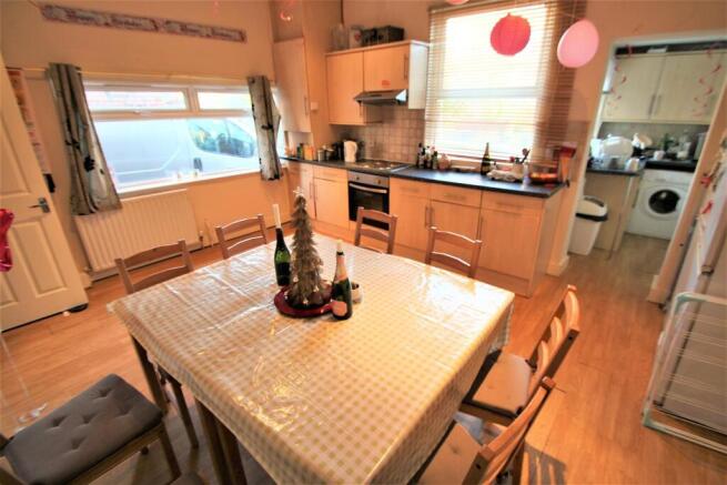 Bright and inviting kitchen area with ample nat...