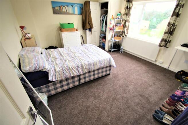 Bright and welcoming living room with ample nat...