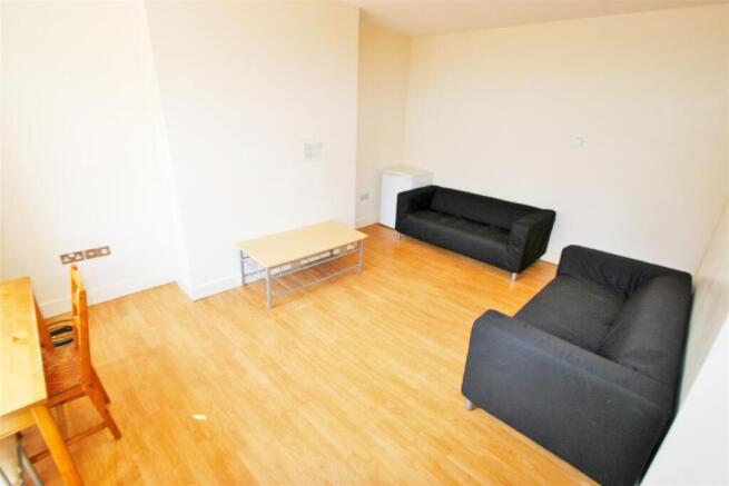 Bright and welcoming living room with ample nat...