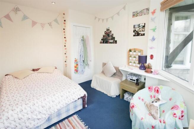 Bright and charming bedroom with a cozy double ...