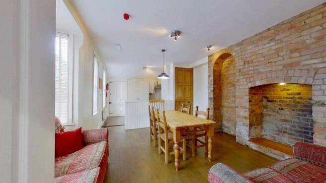 Bright open-plan living and dining area with wo...