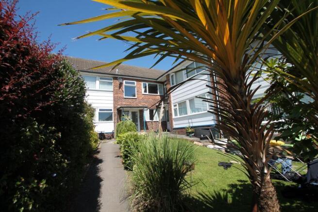 A charming front view of a semi-detached house ...