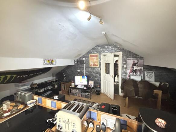 A spacious and well-lit living room with modern...