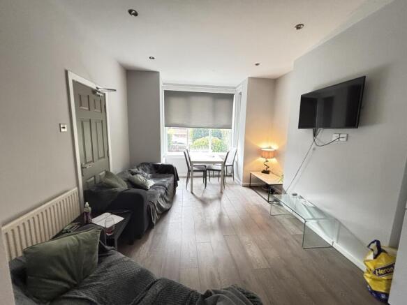 A spacious and modern living room with ample na...