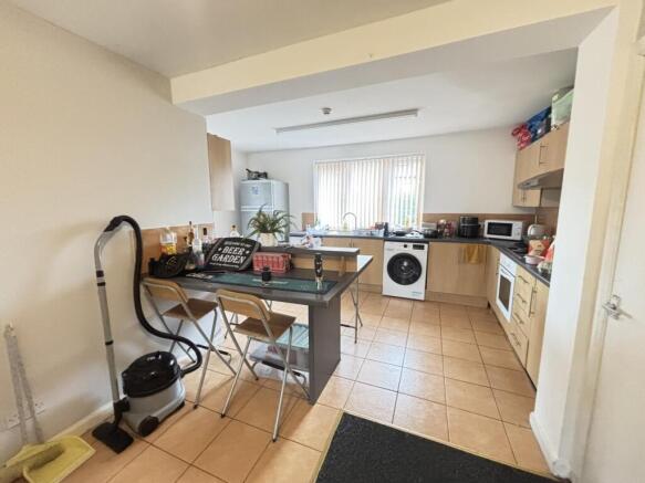 A bright and functional kitchen with ample natu...