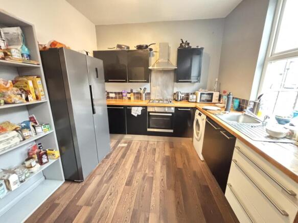 Bright and modern kitchen area featuring ample ...