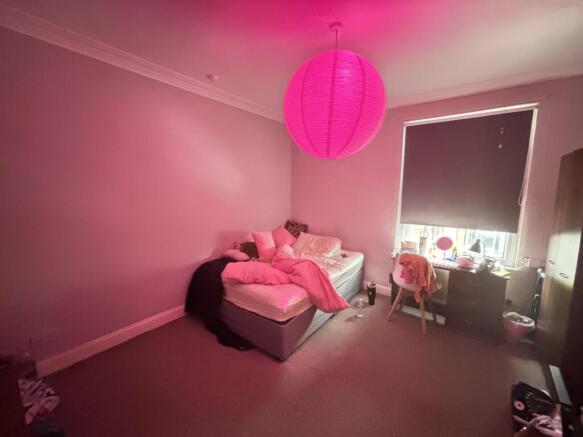 A spacious and inviting master bedroom with a c...