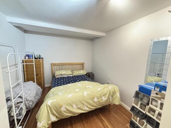 A cozy double bedroom featuring a comfortable b...