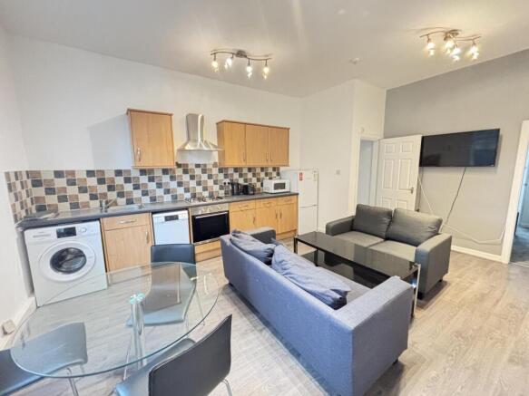 A modern, well-lit living area featuring contem...