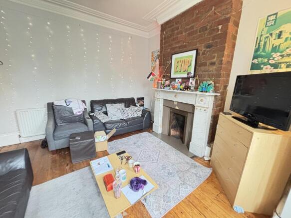 A well-lit, comfortable living room with modern...