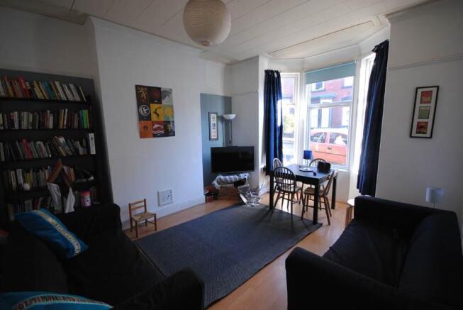 A bright and inviting living room with plenty o...