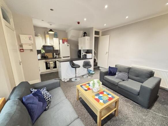 A contemporary and well-maintained living room ...