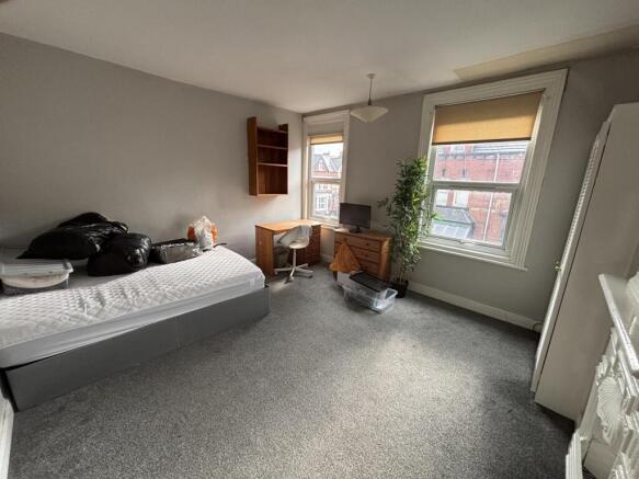 Bright and welcoming living room with large win...