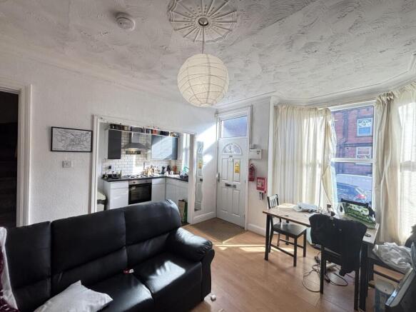 Bright and welcoming living room featuring comf...