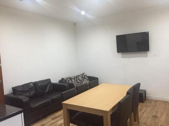 Furnished living room featuring a comfortable b...