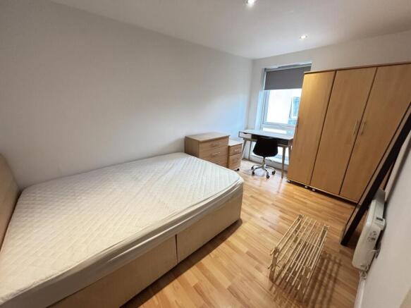 A bright and airy double bedroom featuring a co...