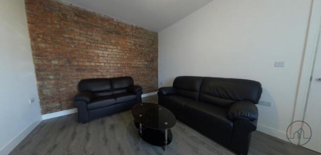 A spacious and modern living room featuring com...