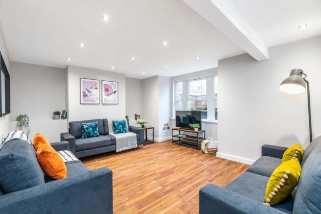 Bright and spacious living room featuring moder...