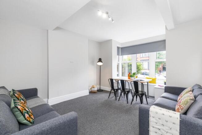 Bright and welcoming living room with modern fu...