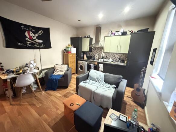 A bright and welcoming living room featuring co...