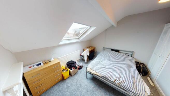 Bright and welcoming bedroom with ample natural...