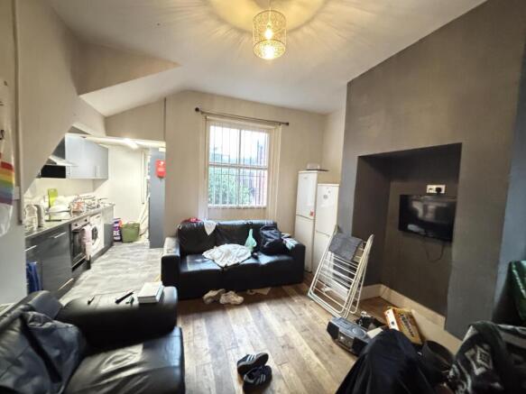 A cozy and well-lit living room with a large wi...