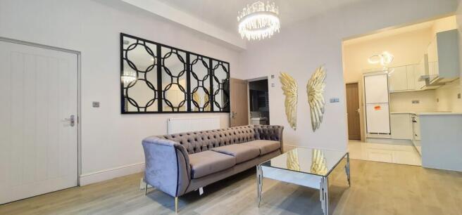 A spacious and well-maintained living room feat...