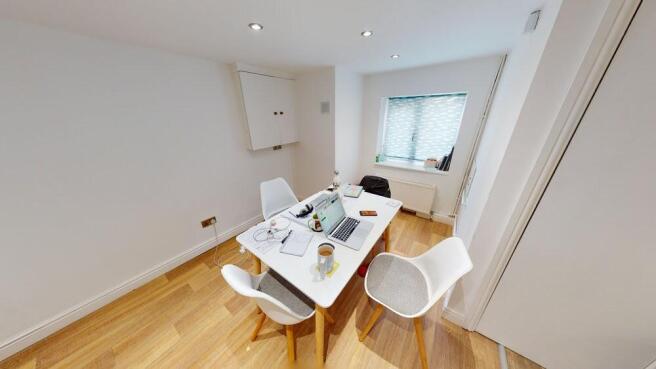 Bright and modern living room featuring ample n...