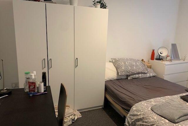 A comfortable double bedroom featuring a bed wi...