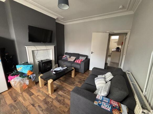 A spacious and well-maintained living room feat...