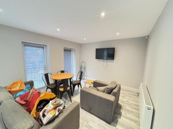 A bright and modern living room with large wind...