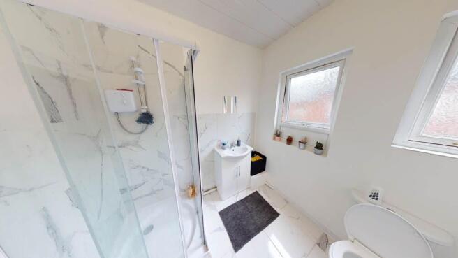 Bright and well-maintained bathroom featuring a...