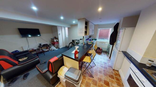 A spacious and well-lit living room featuring m...