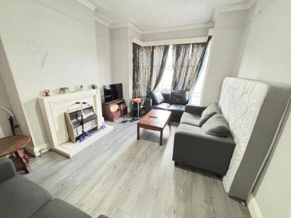 A bright and spacious living room featuring a l...