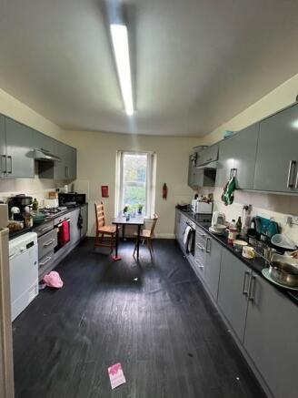 A well-lit, modern kitchen with ample cabinetry...